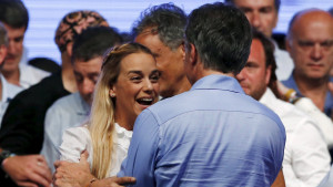 Mauricio Macri, presidential candidate of Cambiemos (Let's Change) coalition (back to camera) is greeted by Lilian Tintori (L), wife of jailed Venezuelan opposition leader Leopoldo Lopez, after the presidential election in Buenos Aires, Argentina, November 22, 2015 .Conservative opposition candidate Macri comfortably won Argentina's presidential election on Sunday after promising business-friendly reforms to spur investment in the struggling economy. REUTERS/Ivan Alvarado