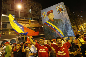 Supporters of Venezuelan president Hugo Chavez gather outside Miraflores Palace to wait for the results of Presidential elections in Caracas