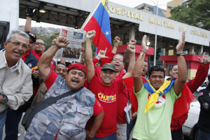 Supporters of Venezuela's President Chavez cheer outside military hospital after his surprise return to Caracas