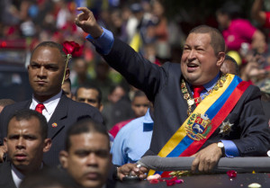 Venezuela¿s President Hugo Chavez waves to supporters as he arrives t