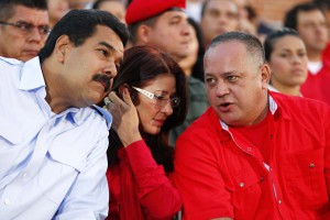 Venezuela's President Nicolas Maduro sits next to his wife Cilia Flores as he talks to National Assembly President Diosdado Cabello in Caracas